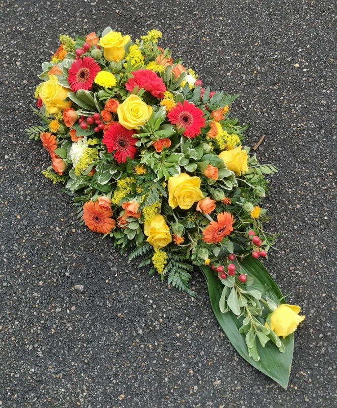 funeral flowers, spray, oasis, orange, yellow, red  colourful, harold wood florist, delivery, romford 