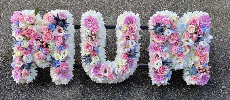 letters, name, mum, mummy, pinks, yellows, whites, mother,  funeral flowers, oasis, tribute, wreath,delivery, harold wood, romford, havering