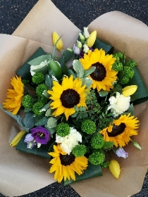 Sunflower Helianthus bouquet with rolled leaves and green chrysanthemum 